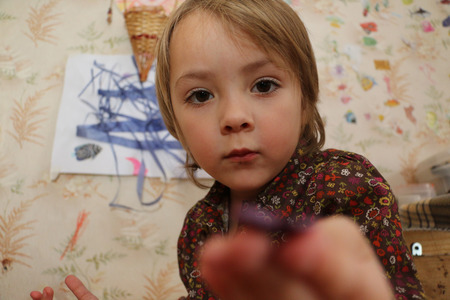 Beautiful girl in the playroom full of toys