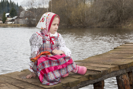 Beautiful young Russian girl in national dress