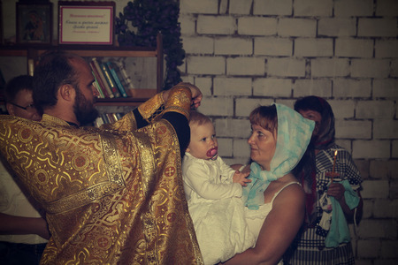 Russia, Kirov - June 10, 2016: Baby Baptism in church of village Viaz in Kirov city in 2016のeditorial素材