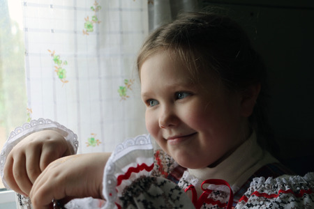 Beautiful young Russian girl in national dressの写真素材