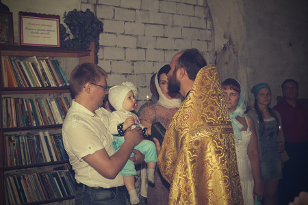 Russia, Kirov - June 10, 2016: Baby Baptism in church of village Viaz in Kirov city in 2016