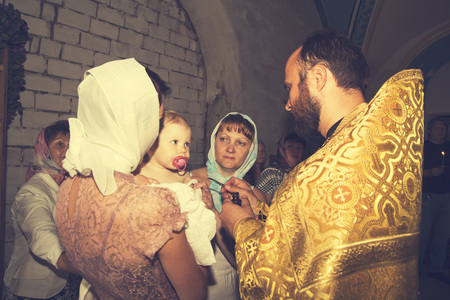 Russia, Kirov - June 10, 2016: Baby Baptism in church of village Viaz in Kirov city in 2016