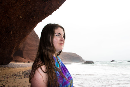 Girl, beach and sea in cloudy and foggy dayの写真素材