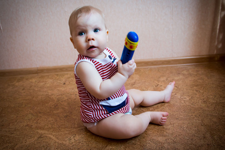 Cute funny young childl in the roomの写真素材