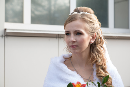 Beautiful bride in white dress waits weddingの写真素材