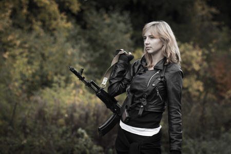 Nice girl with arms in autumn dayの写真素材