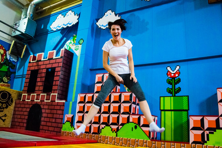 Nice sport girl makes funny physical exercises