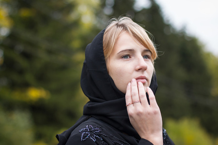 Nice girl outdoor in an autumn dayの写真素材