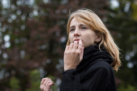 Nice girl outdoor in an autumn day