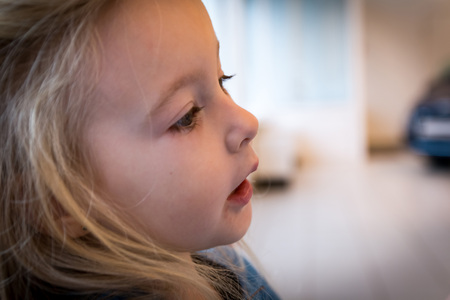 Small girl in exhibition room for carの写真素材
