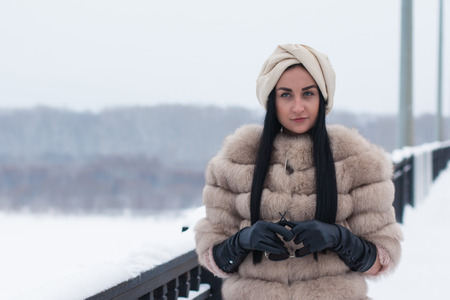 Nice girl outdoor in a winter dayの写真素材