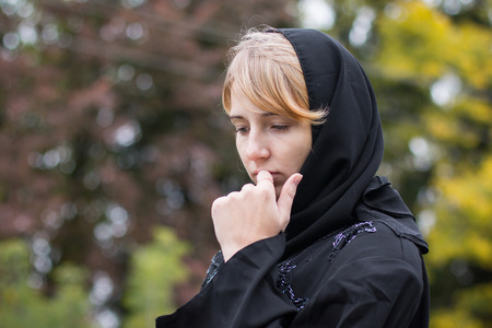 Nice girl outdoor in an autumn dayの写真素材