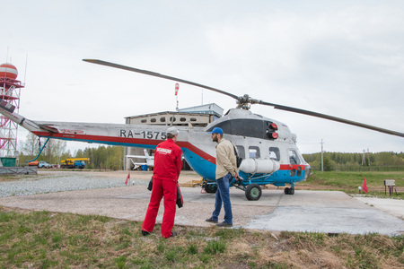 Kirov, Russia - May 07, 2016: The helicopter on a field near village Kuchani near Kirov city in 2016のeditorial素材