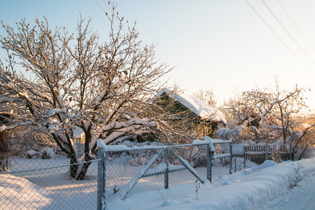 Winter village and snow around in a nice dayの写真素材