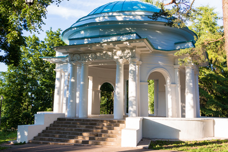 White gazebo in a park in a summer dayの写真素材
