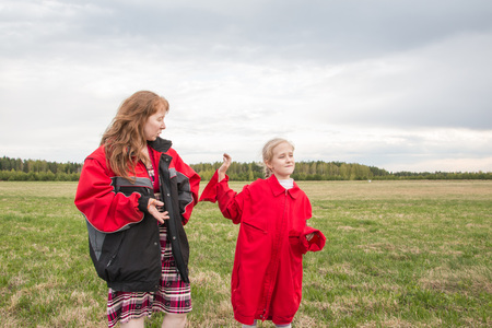 Mother and daughter outdoor and cloudy sky backgroundの写真素材