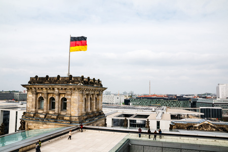 Germany, Berlin - April, 21, 2017: Roof of the Reichstag and the flag of Germany in Berlin in 2017のeditorial素材