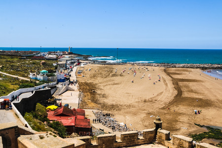 Beach umbrellas on the sandy beach by the seaの写真素材