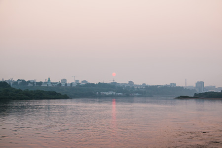 The evening sun and the sunset over the water on a summer eveningの写真素材