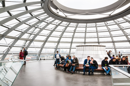 Germany, Berlin - April, 21, 2017: The glass dome of the Reichstag and the people in it in Berlin in 2017のeditorial素材