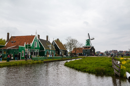 Netherlands, Zaanse Schans - April, 24, 2017: Windmill and the landscape around in a cloudy day in Zaanse Schans in 2017のeditorial素材