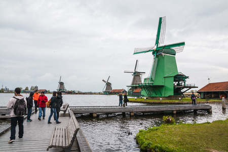 Netherlands, Zaanse Schans - April, 24, 2017: Windmill and the landscape around in a cloudy day in Zaanse Schans in 2017のeditorial素材