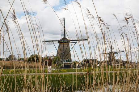 Netherlands, Kinderdijk - April, 26, 2017: Mills and water channel in Kinderdijk in 2017のeditorial素材