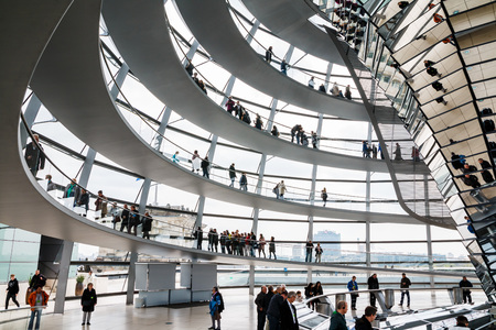 Germany, Berlin - April, 21, 2017: The glass dome of the Reichstag and the people in it in Berlin in 2017のeditorial素材