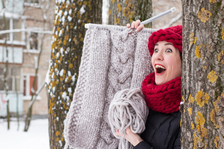 Cute girl in a warm hat in winter dayの写真素材