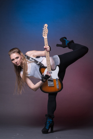 Russia, Kirov - April, 04, 2017: Girl with guitar at the rehearsal before the performance in Kirov city in 2017のeditorial素材