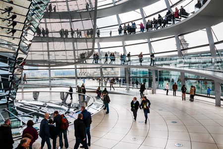 Germany, Berlin - April, 21, 2017: The glass dome of the Reichstag and the people in it in Berlin in 2017のeditorial素材
