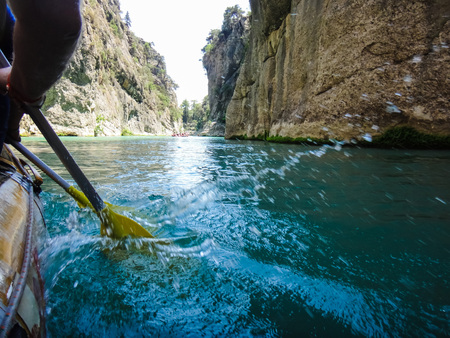 Paddle, river and the side of the boat during rafting in river in mountainの写真素材
