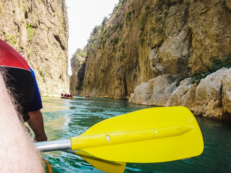 Paddle, river and the side of the boat during rafting in river in mountainの写真素材