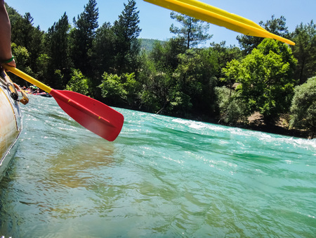 Paddle, river and the side of the boat during rafting in river in mountainの写真素材