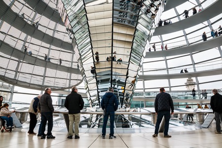 Germany, Berlin - April, 21, 2017: The glass dome of the Reichstag and the people in it in Berlin in 2017のeditorial素材