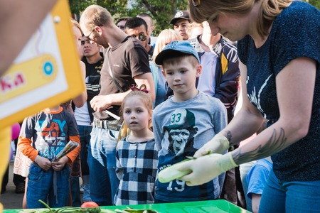 Russia, Kirov - June, 12, 2017: People in the open festival called Delicious Vyatka - Vkusnaya Vyatka during barbecue in the birthday of Kirov city in 2017のeditorial素材