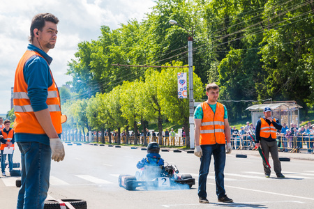 Russia, Kirov - June, 12, 2017: Car and kart driver in fast moving during the open competitions in the birthday of city Kirovのeditorial素材
