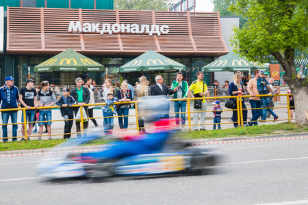 Russia, Kirov - June, 12, 2017: Car and kart driver in fast moving during the open competitions in the birthday of city Kirovのeditorial素材