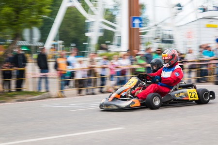 Russia, Kirov - June, 12, 2017: Car and kart driver in fast moving during the open competitions in the birthday of city Kirovのeditorial素材