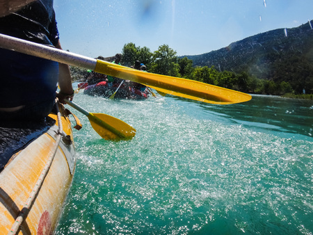 Paddle, river and the side of the boat during rafting in river in mountain