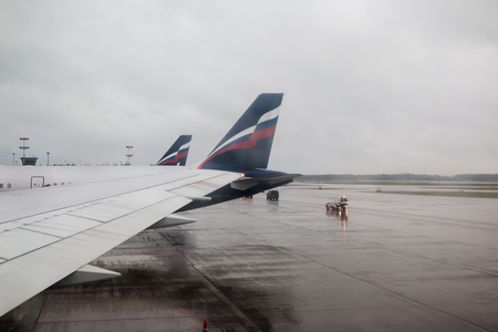 Russia, Moscow - June, 22, 2017: Airplane in Sheremetyevo airport in Moscow through glass of windowのeditorial素材