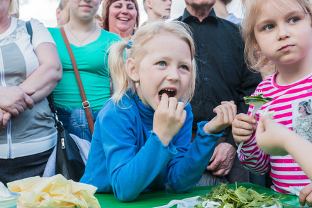 Russia, Kirov - June, 12, 2017: People in the open festival called Delicious Vyatka - Vkusnaya Vyatka during barbecue in the birthday of Kirov city in 2017のeditorial素材