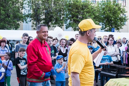 Russia, Kirov - June, 12, 2017: People in the open festival called Delicious Vyatka - Vkusnaya Vyatka during barbecue in the birthday of Kirov city in 2017のeditorial素材