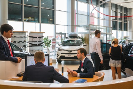 Russia, Kirov - August 21, 2017: Manager and car in showroom of dealership Toyota in Kirov city in 2016のeditorial素材