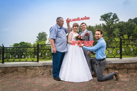 Russia, Kirov - July, 21, 2017: The bride, groom and guests outdoors after the marriage in Kirov city in 2017のeditorial素材