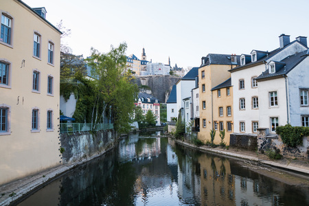 Canal and houses with trees around it in the summerの写真素材