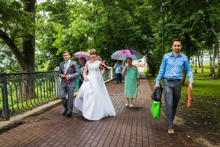 Russia, Kirov - July, 21, 2017: The bride, groom and guests outdoors after the marriage in Kirov city in 2017のeditorial素材