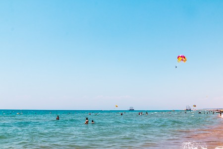 Side, Turkey - June, 26, 2017: Fly with colorful parachute at the beachのeditorial素材