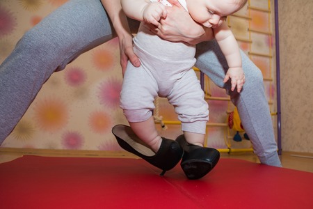 Little girl and beautiful high-heeled shoesの写真素材