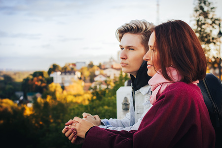 Young mother and adult son outdoor in a autumn